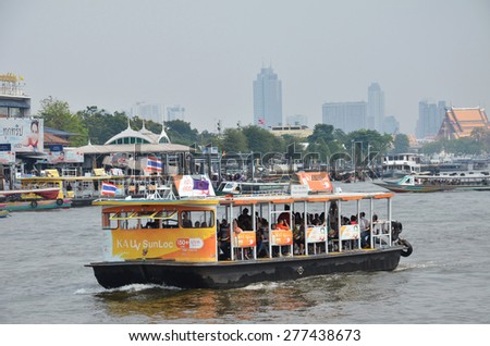 BANGKOK THAILAND - MAR 25: The tourists get on boat for sightseeing along Chao Phraya River in Bangkok on March 25 2015.