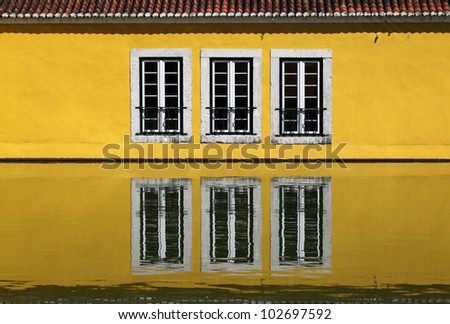 Portugal Lisbon Oeiras Historic gunpowder factory. Mansion windows reflected in the garden pond