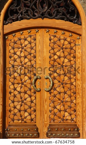 Libya Bengazhi beautiful crafted wooden arabesque door decorated with brass handles and islamic stars