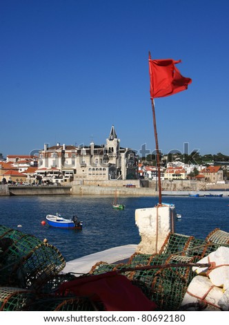 Portugal Cascais on Lisbon\'s Sunshine Coast Cascais bay viewed from the sea-wall with fish traps in foreground