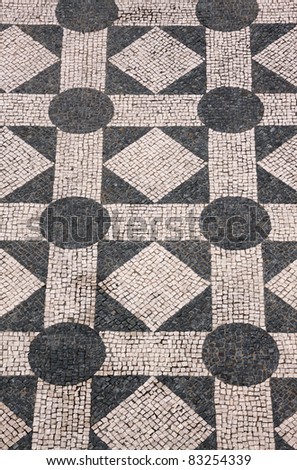 Typical Portuguese black and white mosaic cobblestone  \