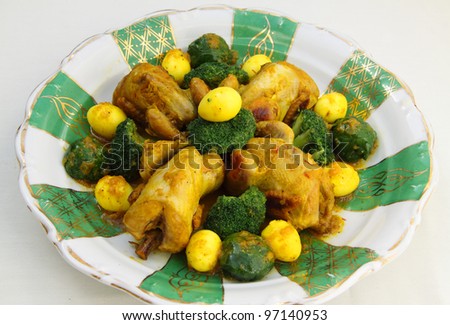 Morocco - Moroccan food. Roast quail with saffron, quail eggs, broccoli and sprouts