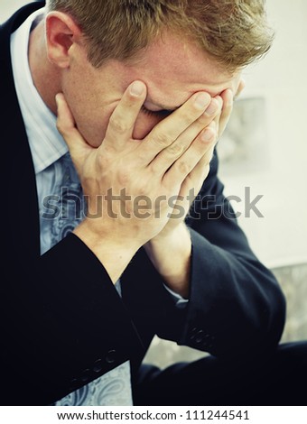 Anguished sad depressed lonely business man