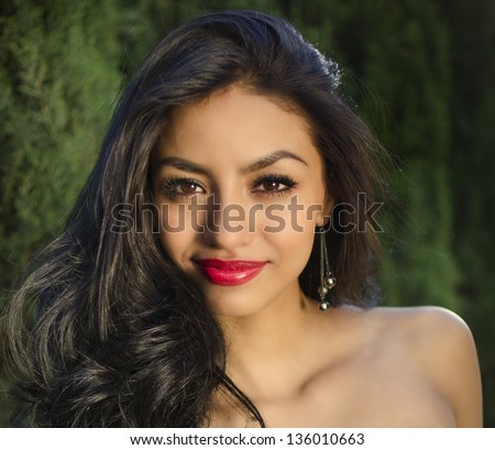Beautiful young mixed race American woman with beautiful long hair, thick full lips