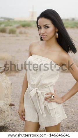 Beautiful young woman in  romper dress