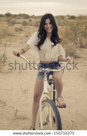 Fashion Art Style Photo ( Soft And Grainy ) Of Boho Californian Girl Riding Beach Bike.