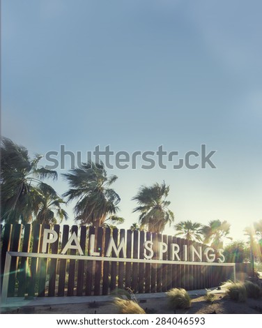 Palm Springs sign - epic sky and sun-flare copy space area