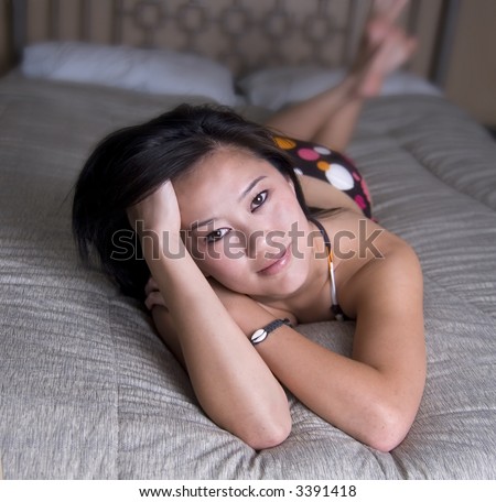 Happy relaxed woman resting in her bedroom.