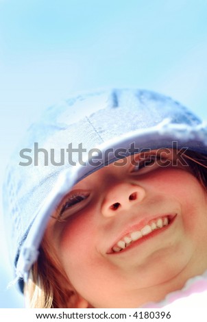 Happy Smiling Child wearing a cap with big smile