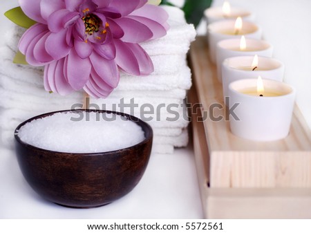Beautiful spa still life with candles flower towels and bath salts