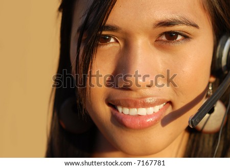 Attractive smiling telephone technical  support woman.