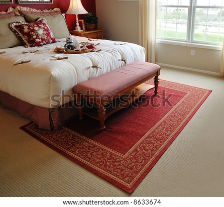 Traditional woven rug in beautiful bedroom