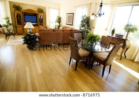 Hardwood Flooring in a large open plan home featuring casual dining area and den