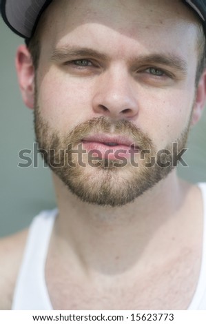 Portrait of a young man enjoying sunny hot day while on vacation