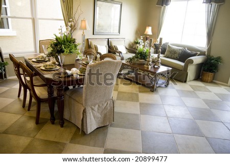 Elegant dining area with living room area in background