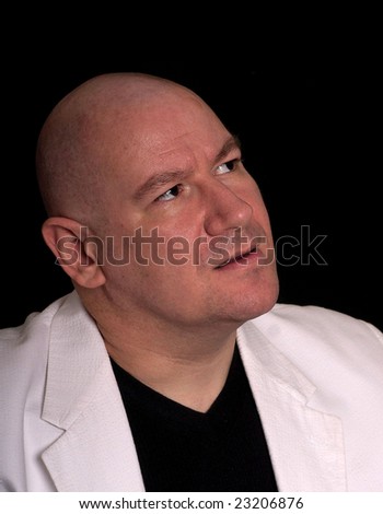 Man with shaved head with his face looking up to the copy space