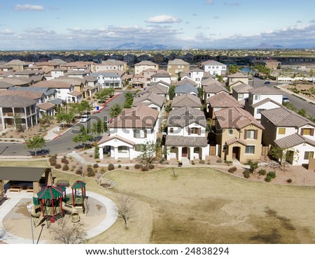 Suburban Arizona community shot from high vantage point looking down onto a housing development