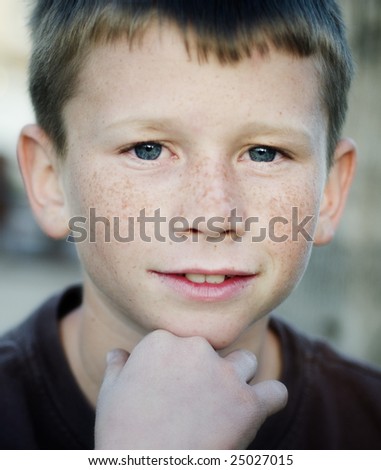 Young boy with blue eyes smiling