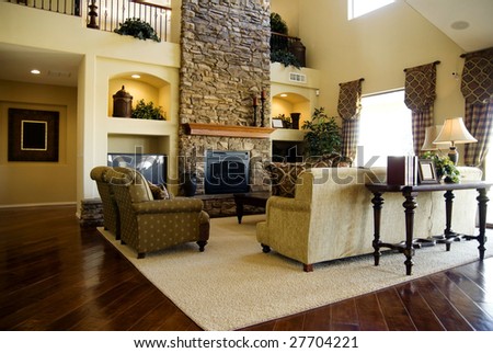 Beautiful large executive home living room area with lush polished hardwood flooring