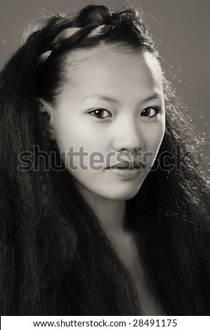Beautiful mixed race woman with long unique hair hair style