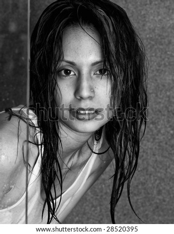Candid portrait of beautiful latino fashion model with wet hair