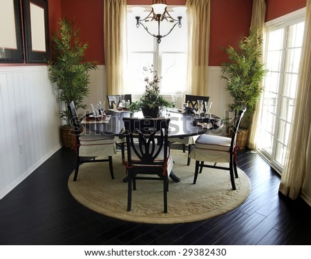 Dining table area of beautiful home with hardwood flooring