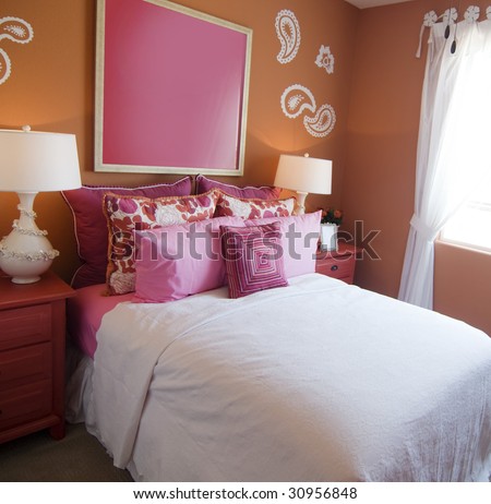 Attractive fun bright modern bedroom for young girls.