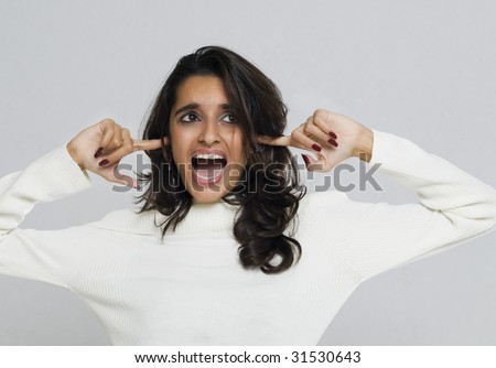 stock-photo-too-much-emotional-stress-and-noise-loud-woman-blocking-noise-by-putting-fingers-in-ears-31530643.jpg