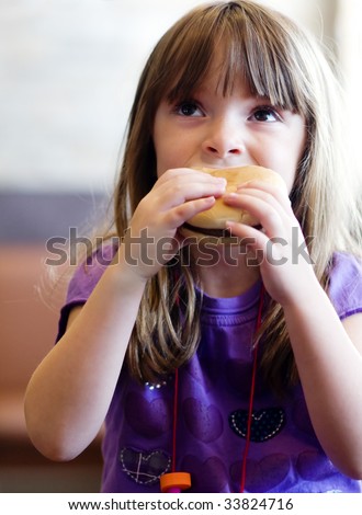 fat man eating burger. girl eating a urger