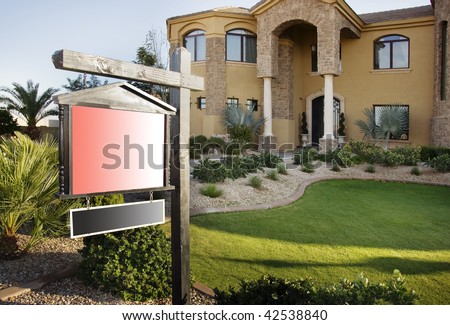 Luxury house for sale with sign well lit by setting sun.