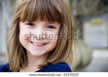 stock photo :  Portrait of a pretty little girl with bright smile