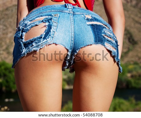 stock photo Wet ripped tiny denim booty shorts