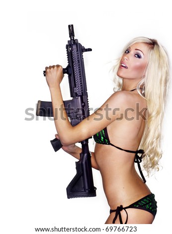 stock photo Beautiful sexy blond woman isolated holding army weapon