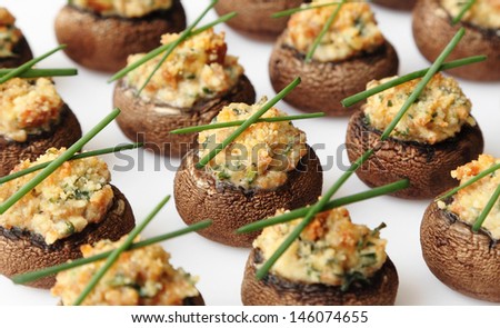 Baked mushroom caps stuffed with sausage, cheese, and spices.