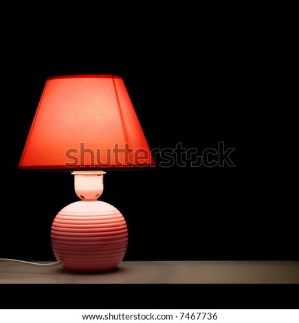 Desk lamp on a black background