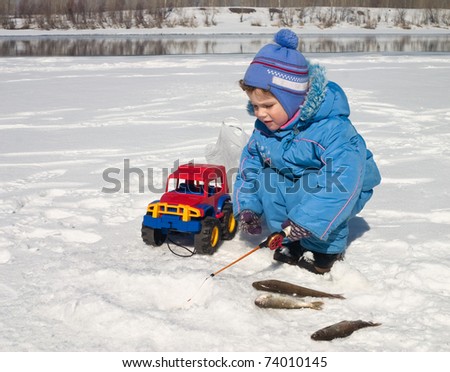 The boy, the child on winter fishing