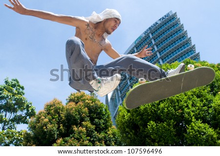 PUTRAJAYA, MALAYSIA - MAY 27: An unidentified skater jumps high in air during  National Youth Day 2012 on May 27, 2012 in Putrajaya Malaysia.