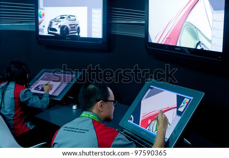KUALA LUMPUR, MALAYSIA - DEC 8: An unidentified artist showcases a digital  sketching of a concept car during Kuala Lumpur International Motor Show on December 8, 2010 in Kuala Lumpur Malaysia.