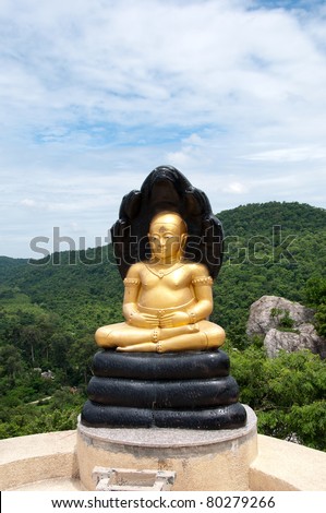 Buddha protect by snake on mountain, Thailand.