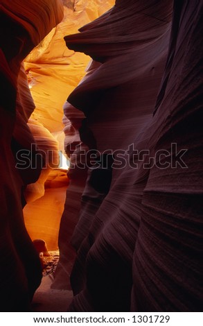 Multicolored sandstone formation sliced through the mesa by rushing water, located in Colorado Plateau.