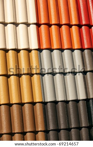 Interlocking Coloured Roof Tiles on display. Replacement roofing. Could be Terracotta roof tiles, concrete tiles, or clay roofing.