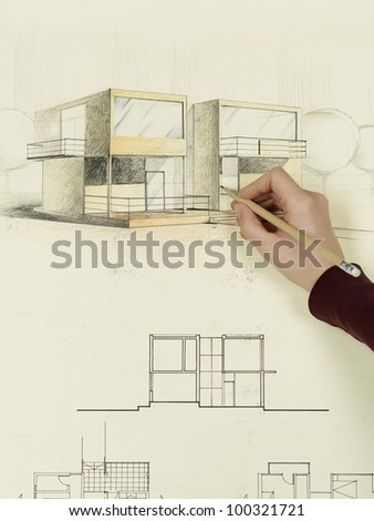 woman\'s hand drawing architectural perspective of modern house