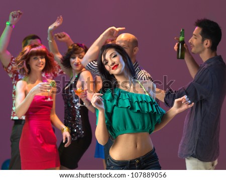 sexy, young woman dancing on the dancefloor, in a night club