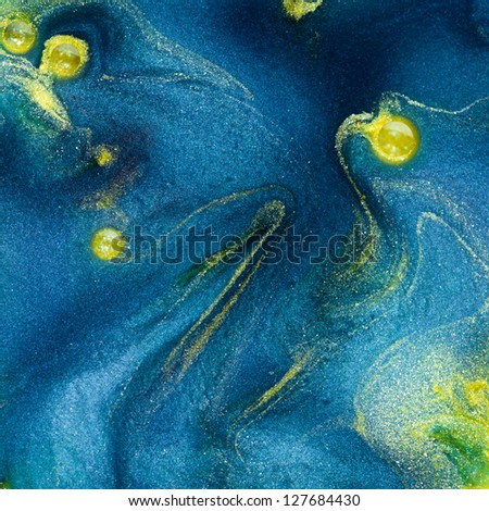 macro of blue colored pigment with yellow waves insertions