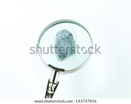 top view of a fingerprint viewed through a magnifying glass, against a white background