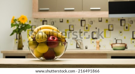 close-up of glass bowl with fruits on kitchen countertop