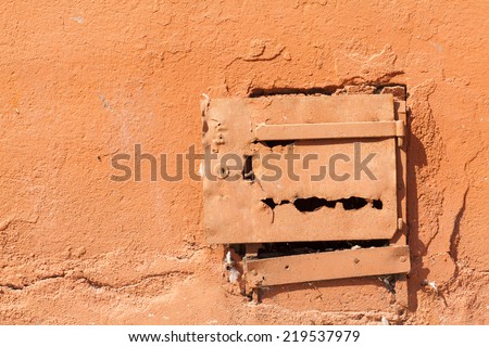 old metal access door in the wall