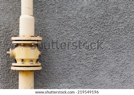 gray wall gas pipe rust points