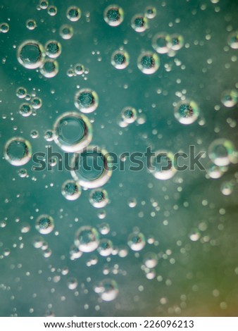 oil on water background resembling sparkling water