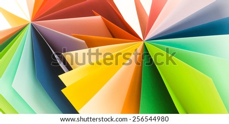 macro of colored paper arranged in fan shape. abstract background
